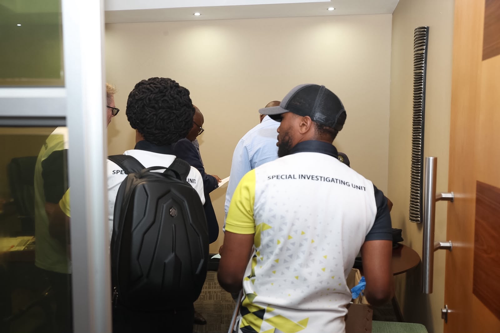 SIU officers on-site during a raid at the PSIRA offices in Centurion following a Special Tribunal search warrant.