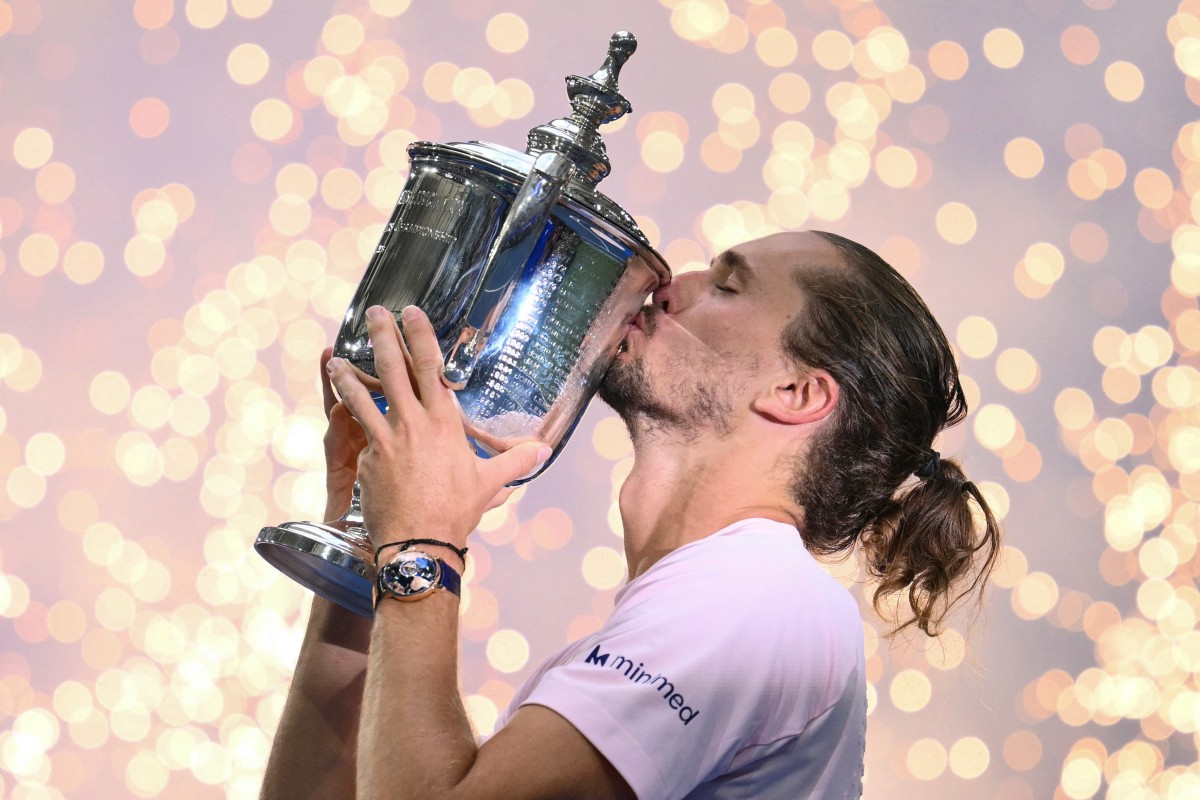 Germany's Alexander Zverev kisses the trophy after defeating USA's Ben Shelton in the US Open men's singles final.