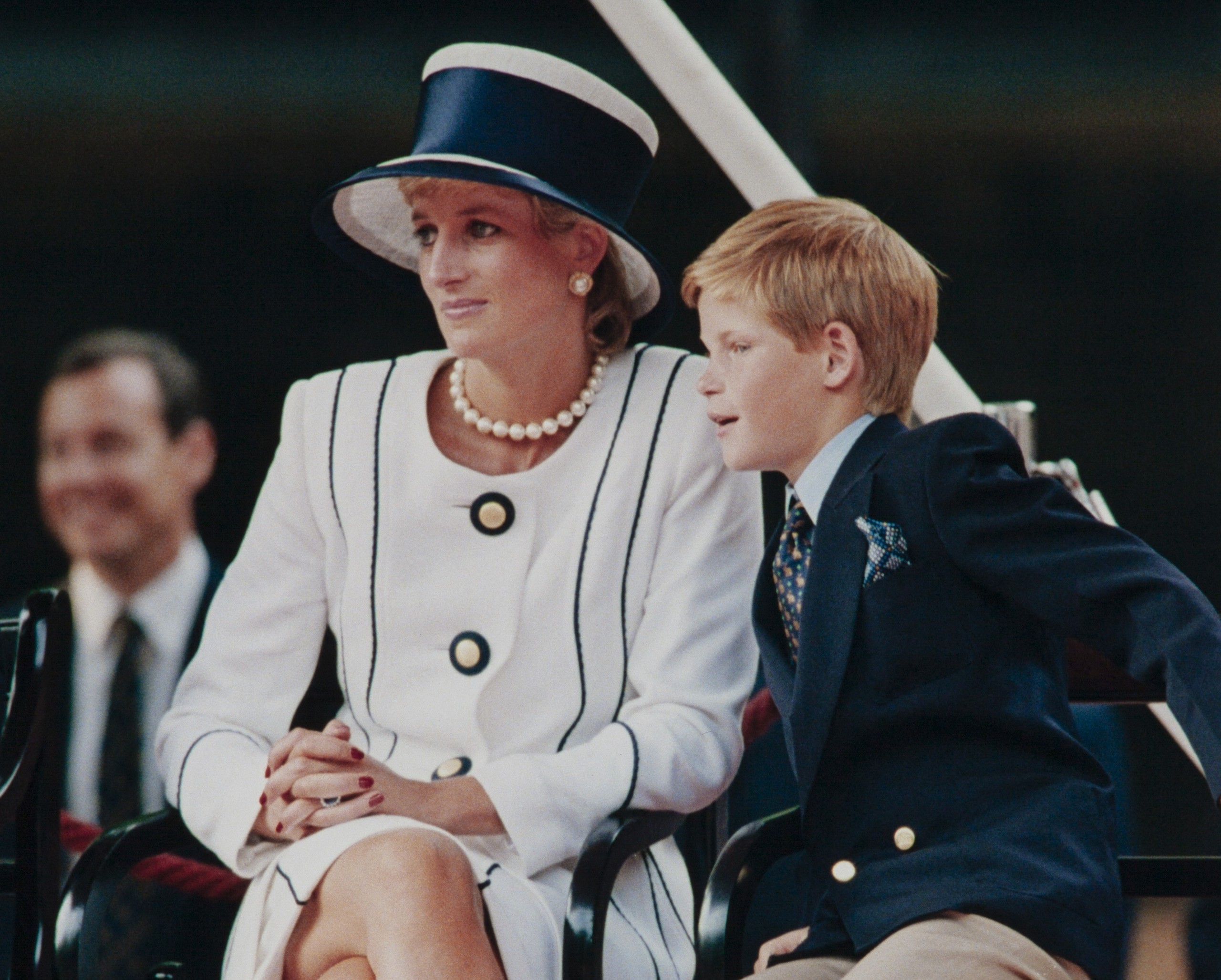 Princess Diana and Prince Harry at an event before her untimely death.