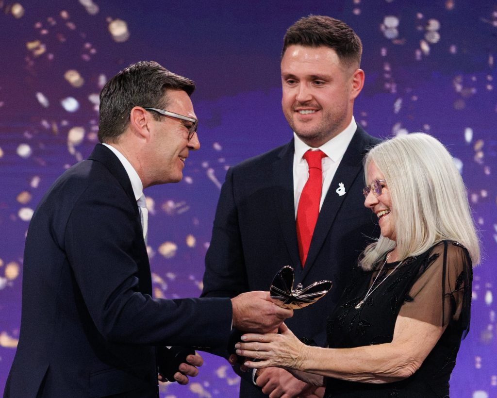Prime Minister Andy Burnham (left) handed the awards over to Luke and Elaine.