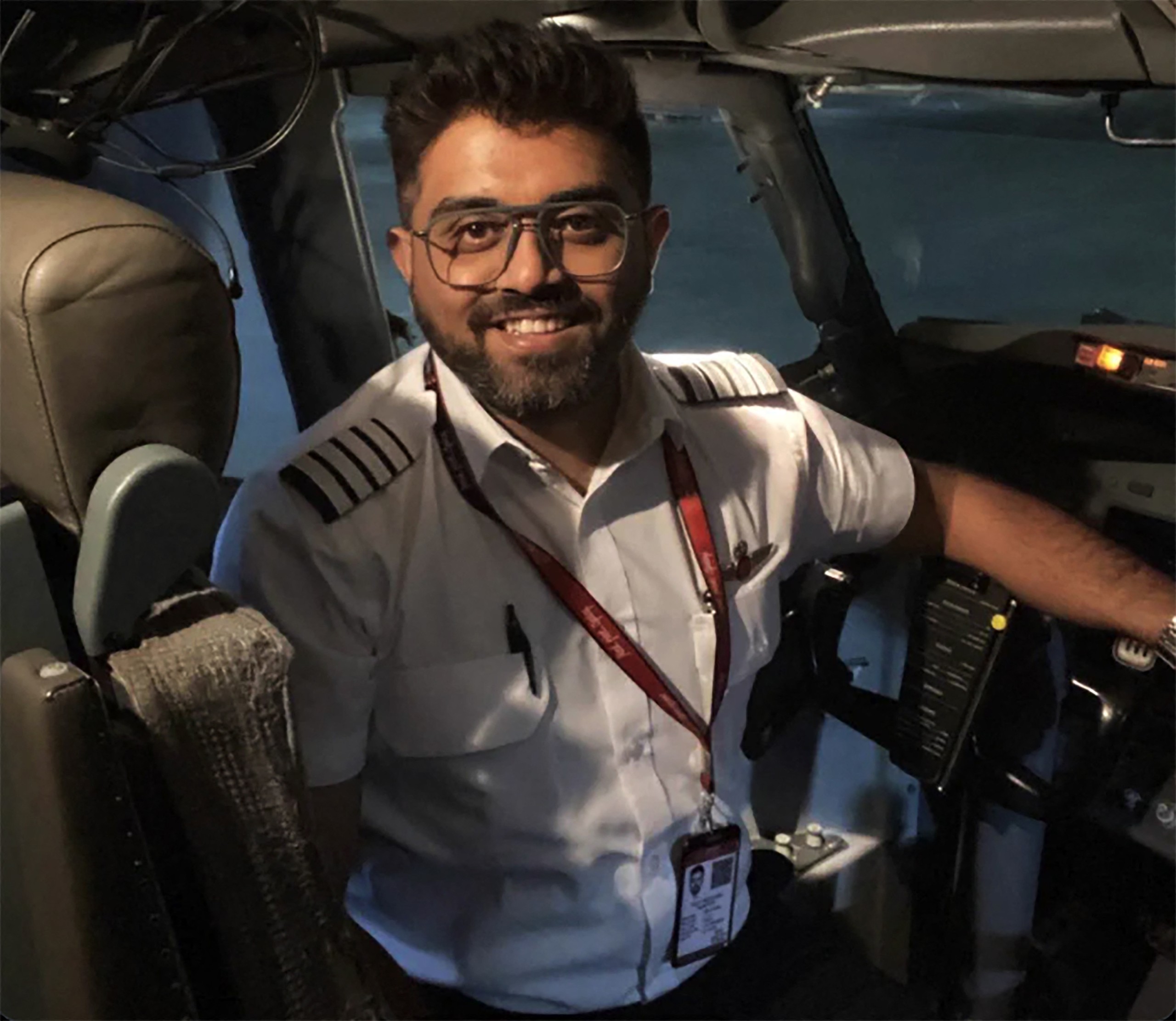 flydubai Pilot Indian Smit Machchhar in the cockpit of an airplane.