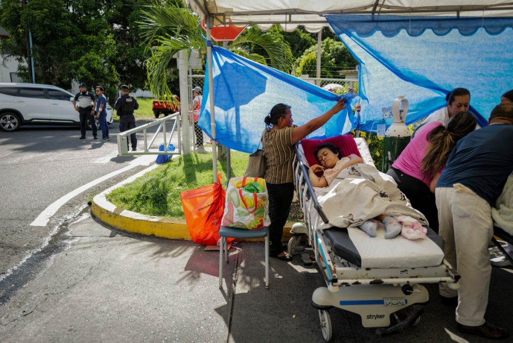 Patients are treated outside Aquilino Tejeira Hospital in Penonome, Panama.