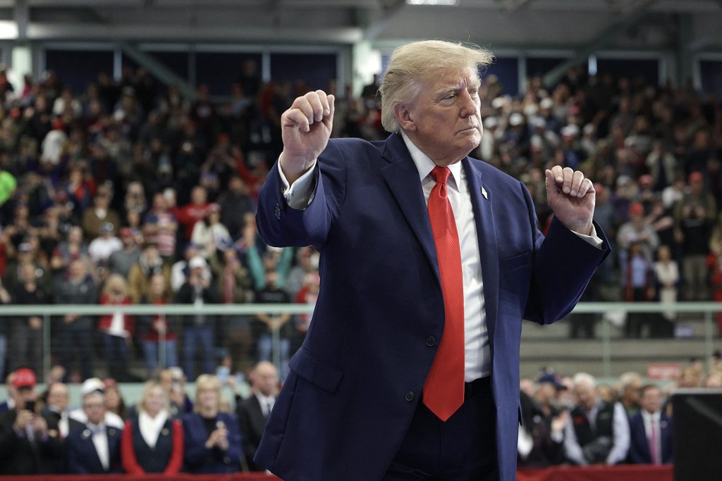 US President Donald Trump dances on stage.