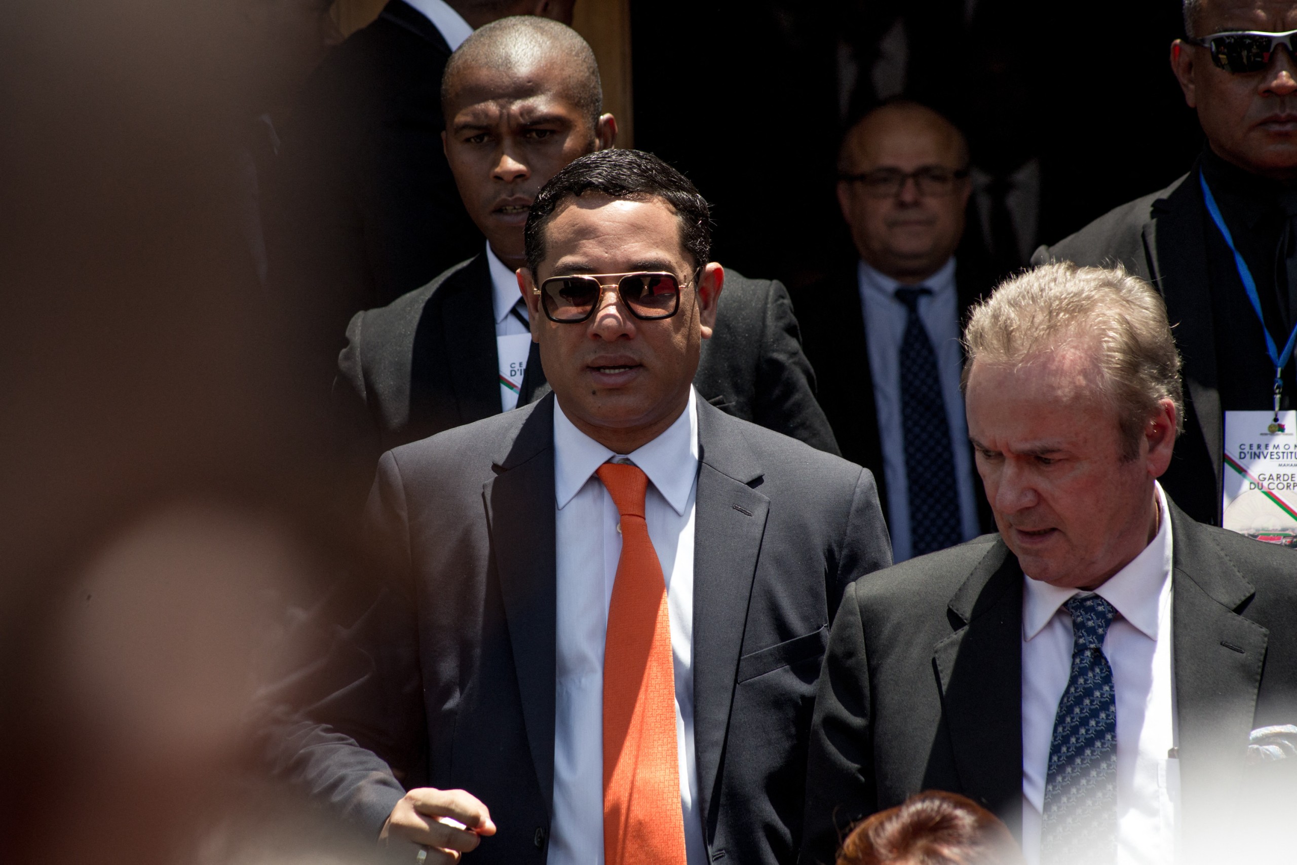 Mamy Ravatomanga (centre) leaves Andry Rajoelina's presidential inauguration ceremony at Mahamasina Stadium in Antananarivo on 19 January 2019. Photo: Rijasolo/AFP
