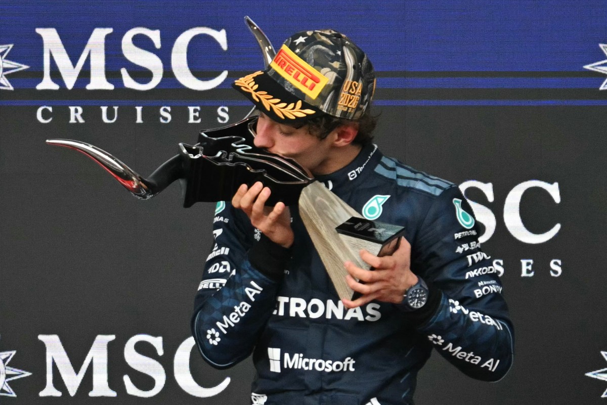 Race winner Mercedes' driver Kimi Antonelli kisses the trophy on the podium at the conclusion of the United States Formula One Grand Prix