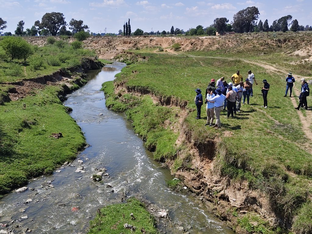 Officials and DA Members next to the Renoster Spruit.