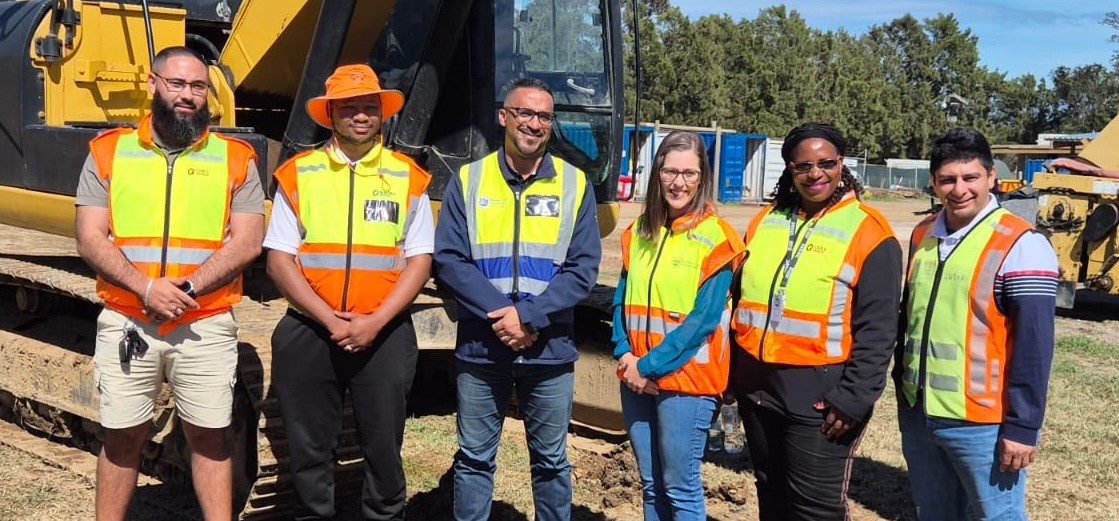 Minister Tertius Simmers (middle), with the Sir Lowry's Pass Road project team.