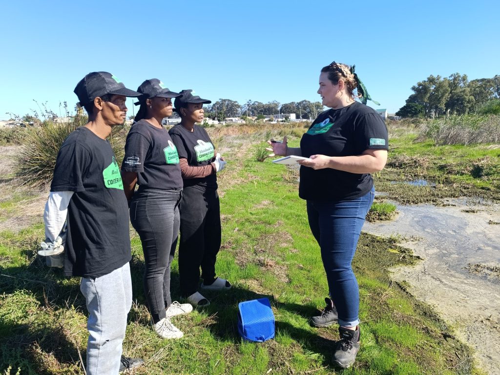 Danielle Cronje providing training next to the river.