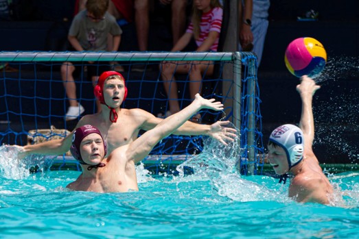 Nic Caley (red cap) and Blake Gaines (maroon cap) in action