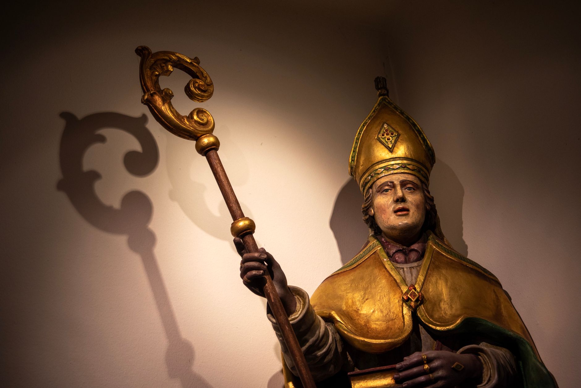 statue of a bishop in holset church