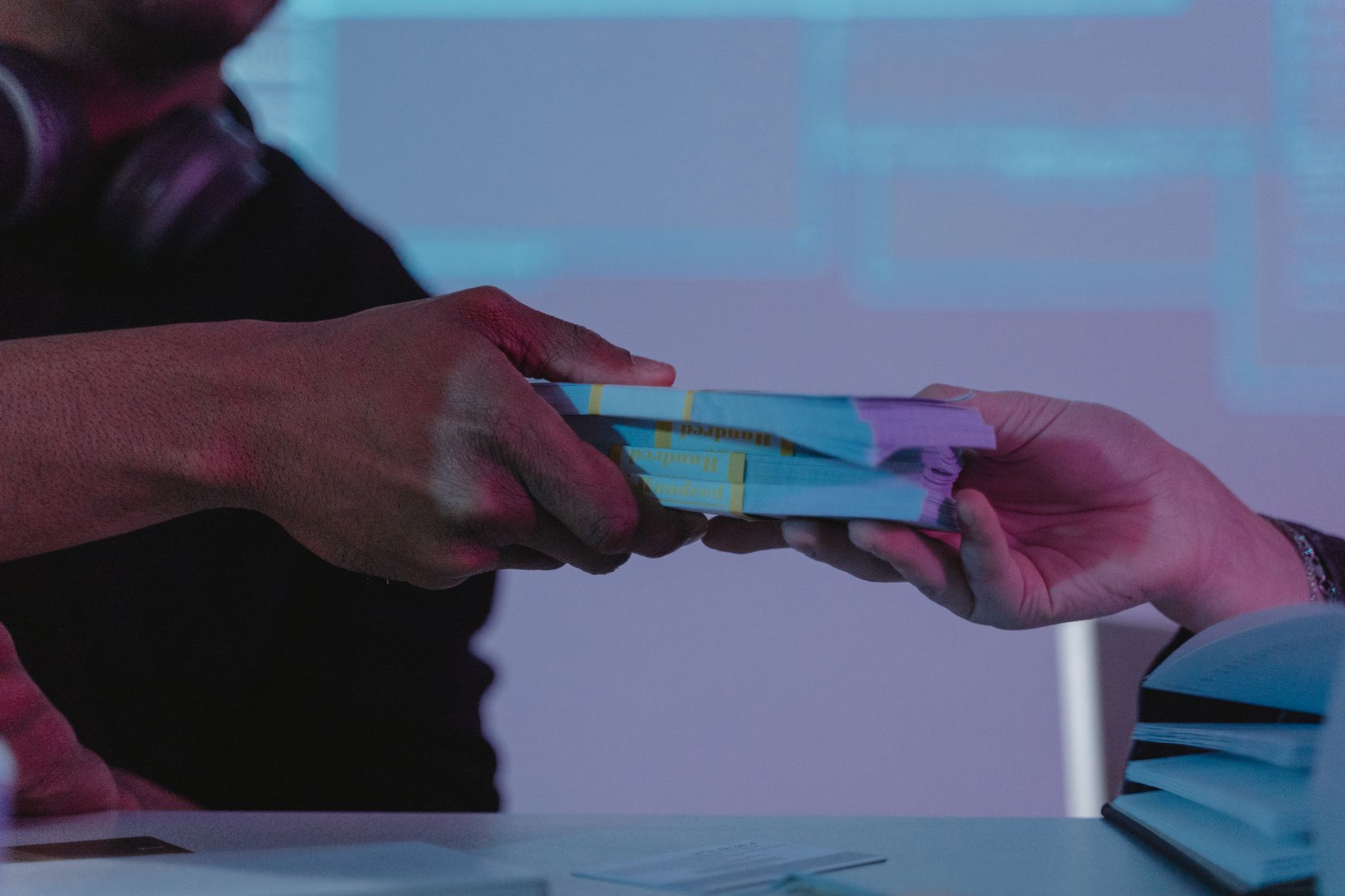 person holding yellow and white plastic pack